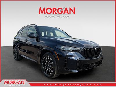 2026 BMW X5 xDrive40i in CARBON BLK MET — front three-quarter view