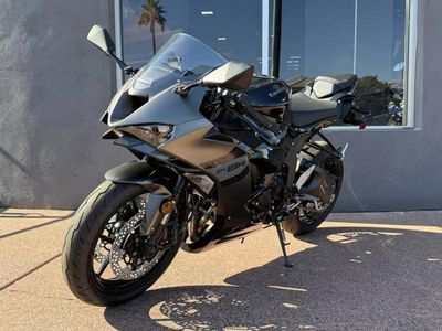 2026 Kawasaki Ninja ZX-6R in Metallic Matte Graphenesteel Gray/Metallic Spark Black/Pearl Storm Gray — front three-quarter view