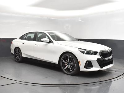 2026 BMW 5 Series N/A in Alpine White — front three-quarter view