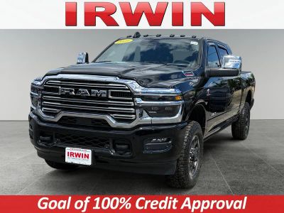 2025 RAM 2500 Laramie in Diamond Black Crystal Pearlcoat — front three-quarter view