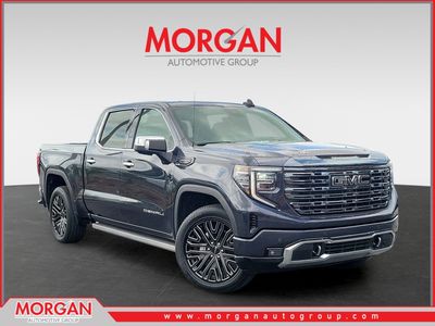 2022 GMC Sierra 1500 Denali Ultimate in Titanium Rush Metallic — front three-quarter view