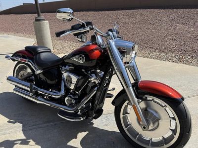 2025 Harley-Davidson FLFB - Fat Boy in WHISKEY FIRE / BLACK — front three-quarter view