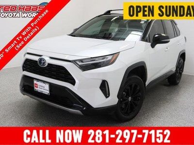2024 Toyota RAV4 AWD Hybrid XSE 2.5L in Wind Chill Pearl/Midnight Black Metallic — front three-quarter view