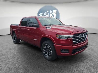 2026 RAM 1500 Laramie in Molten Red Pearlcoat — front three-quarter view