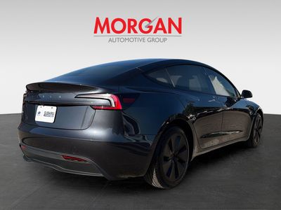2025 Tesla Model 3 — rear three-quarter view