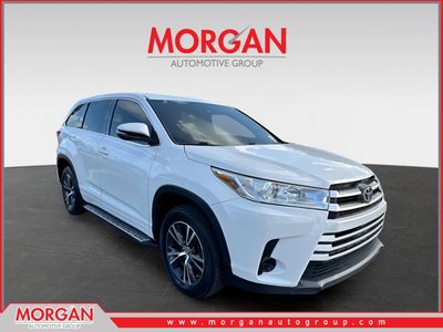 2018 Toyota Highlander LE in Blizzard Pearl — front three-quarter view
