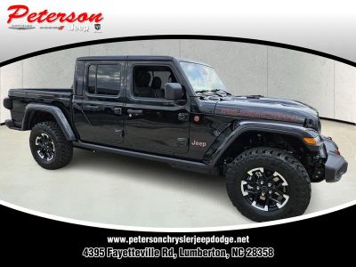 2026 Jeep Gladiator GLADIATOR RUBICON 4X4 in Black Clear-Coat Exterior Paint — front three-quarter view