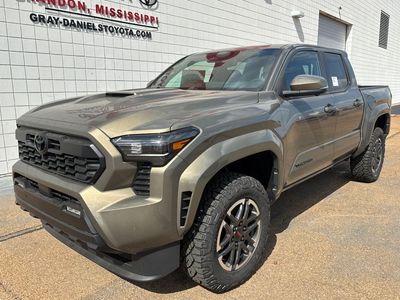 2026 Toyota Tacoma TRD Sport in Bronze Oxide — front three-quarter view