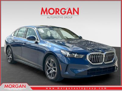 2026 BMW 5 Series 530i in Blue Metallic — front three-quarter view