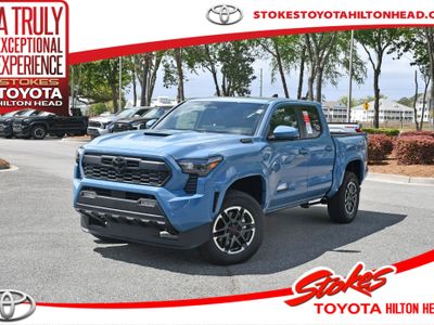 2026 Toyota Tacoma i-FORCE MAX TRD Sport i-FORCE MAX in Heritage Blue — front three-quarter view