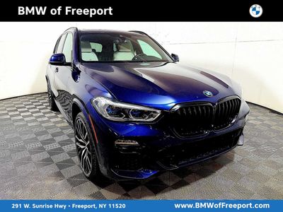 2021 BMW X5 M50i M50i in Tanzanite Blue II Metallic — front three-quarter view