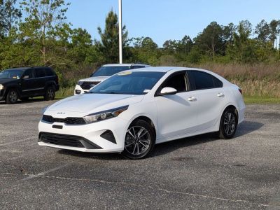 2023 Kia Forte LXS in White — front three-quarter view