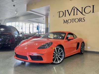 2017 Porsche 718 Cayman in Orange — front three-quarter view