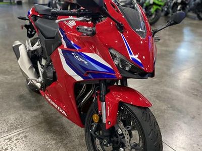 2025 Honda CBR500R CBR500RA in Grand Prix Red — front three-quarter view