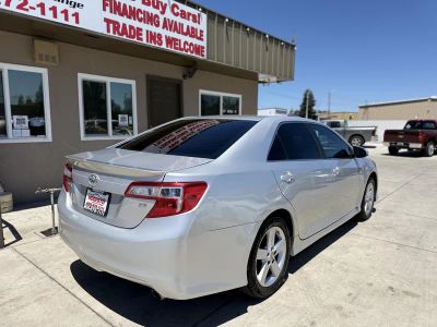 2014 Toyota Camry — rear three-quarter view