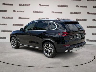2026 BMW X5 — rear three-quarter view