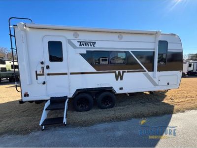 2026 Winnebago Thrive — rear three-quarter view