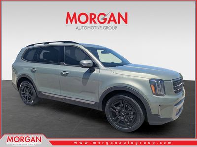 2023 Kia Telluride EX X-Line in Jungle Green — front three-quarter view