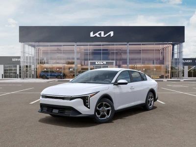 2026 Kia K4 LXS in Snow White Pearl — front three-quarter view