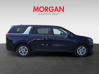 2024 Kia Carnival — rear three-quarter view