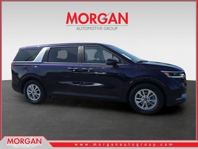 2024 Kia Carnival LX in Blue — front three-quarter view