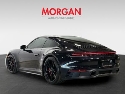 2024 Porsche 911 — rear three-quarter view