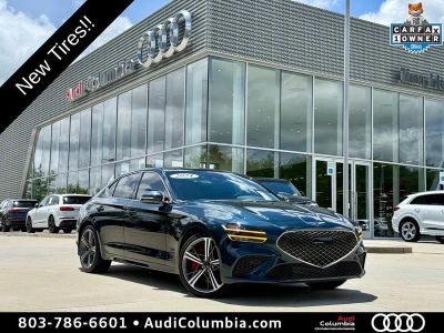 2024 Genesis G70 3.3T Sport Advanced in Tasman Blue — front three-quarter view