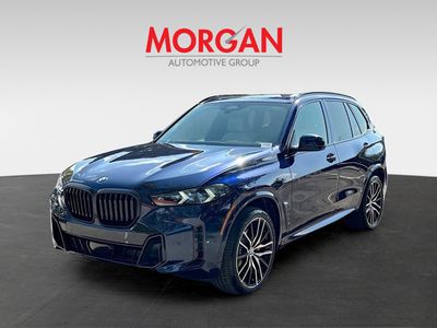 2026 BMW X5 — rear three-quarter view