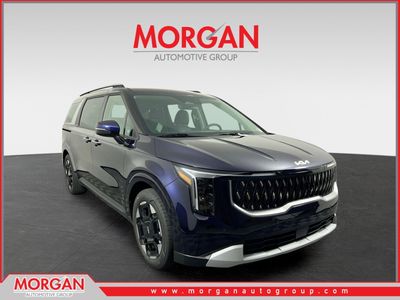 2026 Kia Carnival EX in Deep Chroma Blue — front three-quarter view