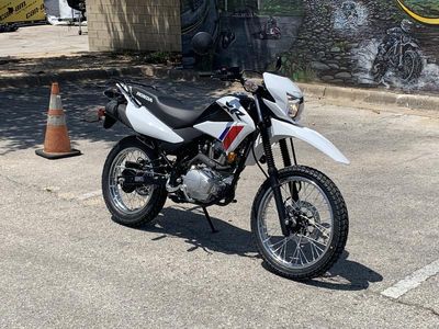 2025 Honda XR150L in WHITE — front three-quarter view