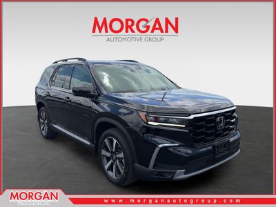 2024 Honda Pilot Touring in Black — front three-quarter view