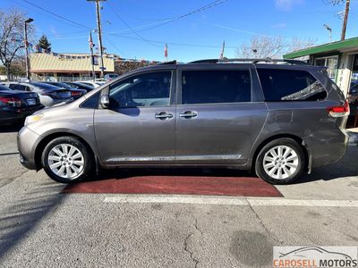 2013 Toyota Sienna — rear three-quarter view