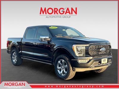 2021 Ford F-150 King Ranch in Black Metallic — front three-quarter view
