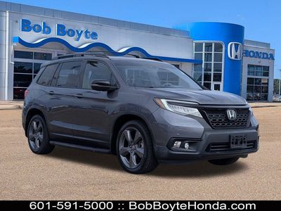 2019 Honda Passport Touring in Modern Steel Metallic — front three-quarter view