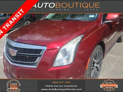 2016 Cadillac XTS Luxury Collection in Red Passion Tintcoat — front three-quarter view