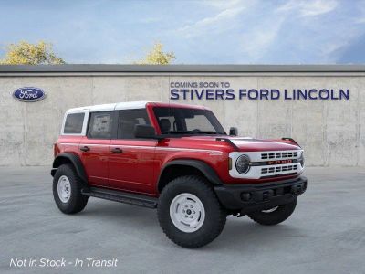 2026 Ford Bronco Heritage Edition in Ruby Red Metallic Tinted Clearcoat — front three-quarter view