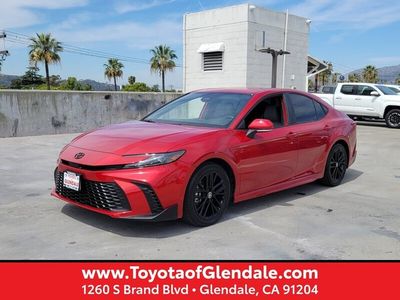 2025 TOYOTA CAMRY LE in Supersonic Red — front three-quarter view