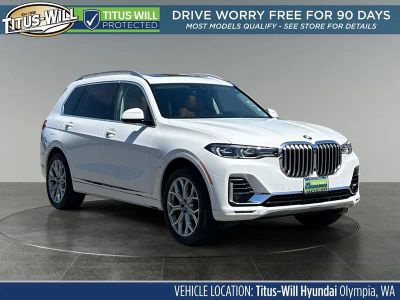 2019 BMW X7 xDrive40i in Alpine White — front three-quarter view
