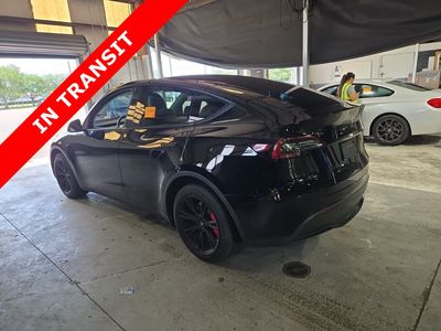 2023 Tesla Model Y — rear three-quarter view