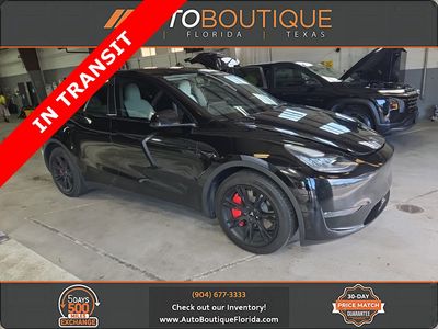 2023 Tesla Model Y Long Range in Black — front three-quarter view