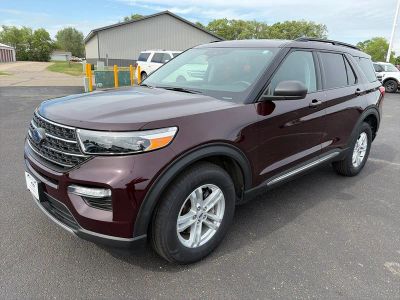 2023 Ford Explorer XLT 4WD in Jewel Red Metallic Tinted Clearcoat — front three-quarter view