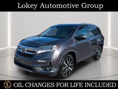 2022 Honda Pilot Touring 8 Passenger in Gray — front three-quarter view