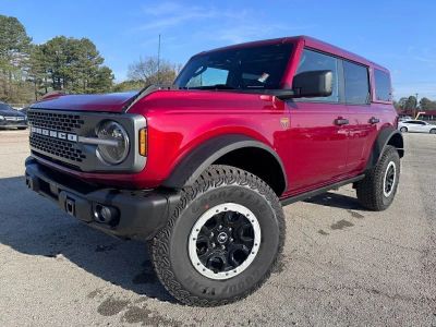 2026 Ford Bronco Badlands in Ruby Red Metallic — front three-quarter view