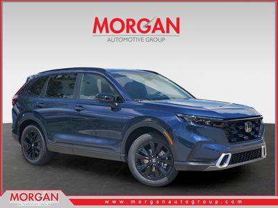 2026 Honda CR-V Hybrid Sport Touring in Canyon River Blue Metallic — front three-quarter view