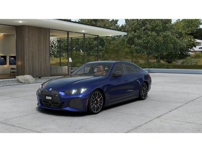 2026 BMW i4 M60 in Portimao Blue Metallic — front three-quarter view