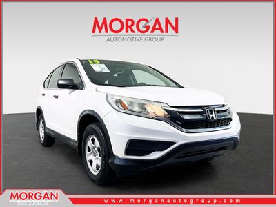 2015 Honda CR-V LX in White — front three-quarter view