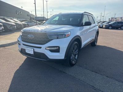 2021 Ford Explorer XLT in Oxford White — front three-quarter view