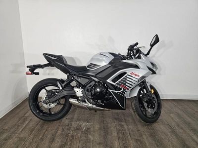 2026 Kawasaki Ninja 650 ABS in METALLIC MATTE WHITISH SILVER/METALLIC FLAT SPARK BLACK — front three-quarter view
