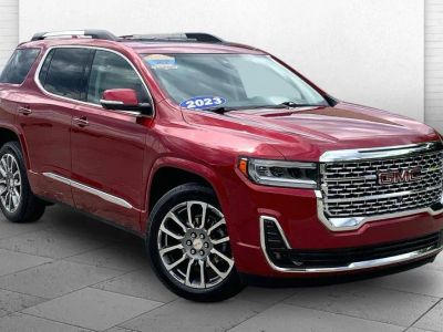 2023 GMC Acadia Denali in Volcanic Red Tintcoat — front three-quarter view