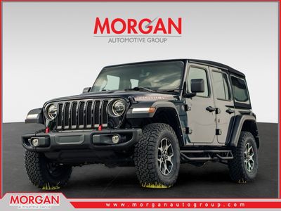 2022 Jeep Wrangler Unlimited Rubicon in Black — front three-quarter view